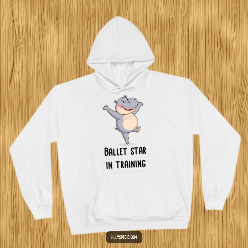 Funny Hoodie showing a happy hippopotamus attempting a ballet pirouette with surprising enthusiasm, a delightful sight.